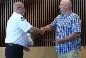 Moses Lake gives Challenge coins to citizens for helping during a fire